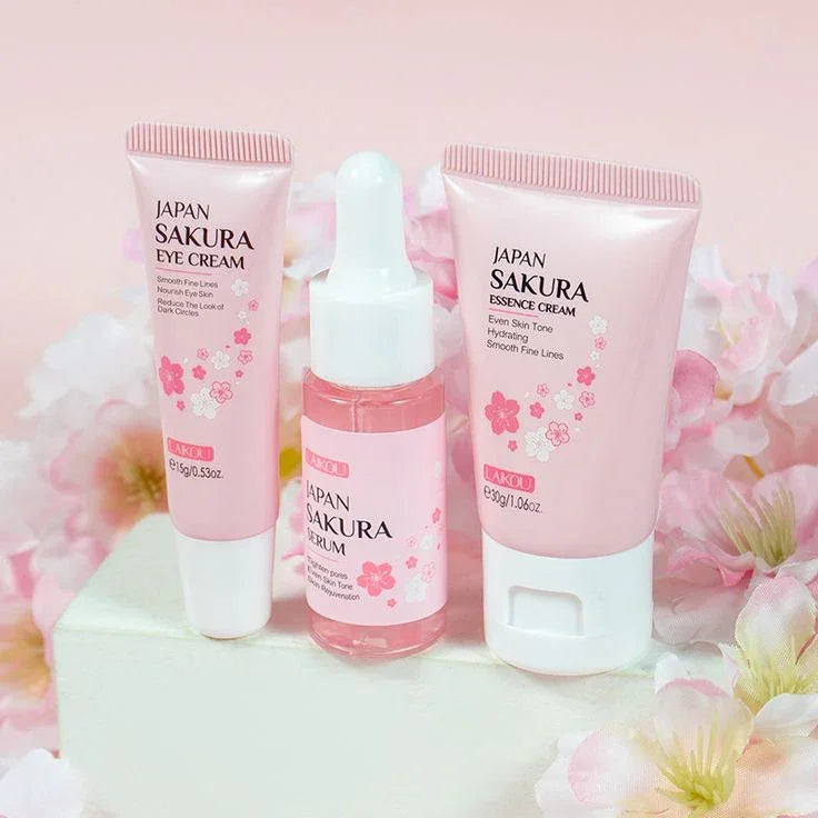 Set de crema, suero y contorno de ojos japoneses con sakura para cuidado facial, fondo floral rosado
