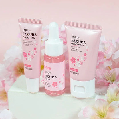 Set de crema, suero y contorno de ojos japoneses con sakura para cuidado facial, fondo floral rosado