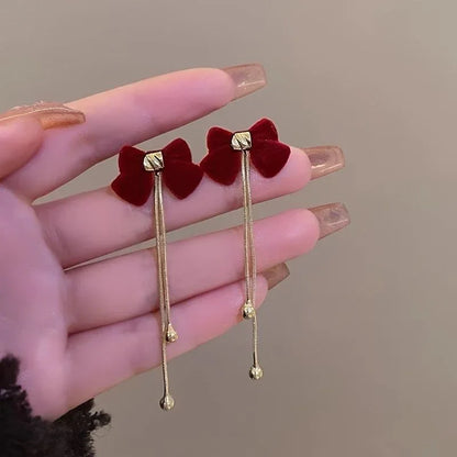 Aretes coreanos de lazo rojo con cadenas doradas, estilo elegante para mujer