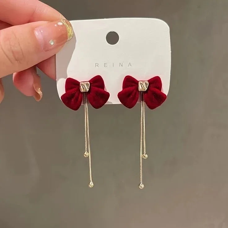 Pendientes largos de lazo rojo con detalle dorado, estilo coreano, accesorios de moda.