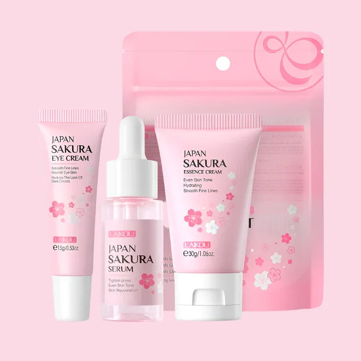 Set de cuidado facial japonés Sakura para mujeres, incluye crema, suero y contorno de ojos, envases rosas con flores de cerezo.