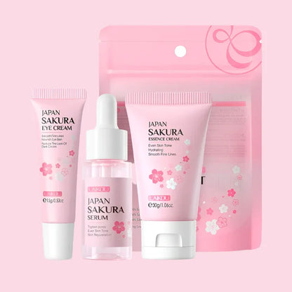 Set de cuidado facial japonés Sakura para mujeres, incluye crema, suero y contorno de ojos, envases rosas con flores de cerezo.